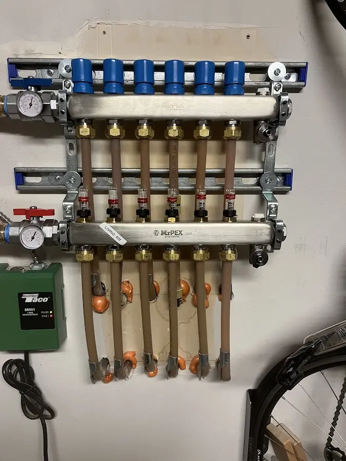 Plumber performing Water Heater Repair at a residential property in Woodfin